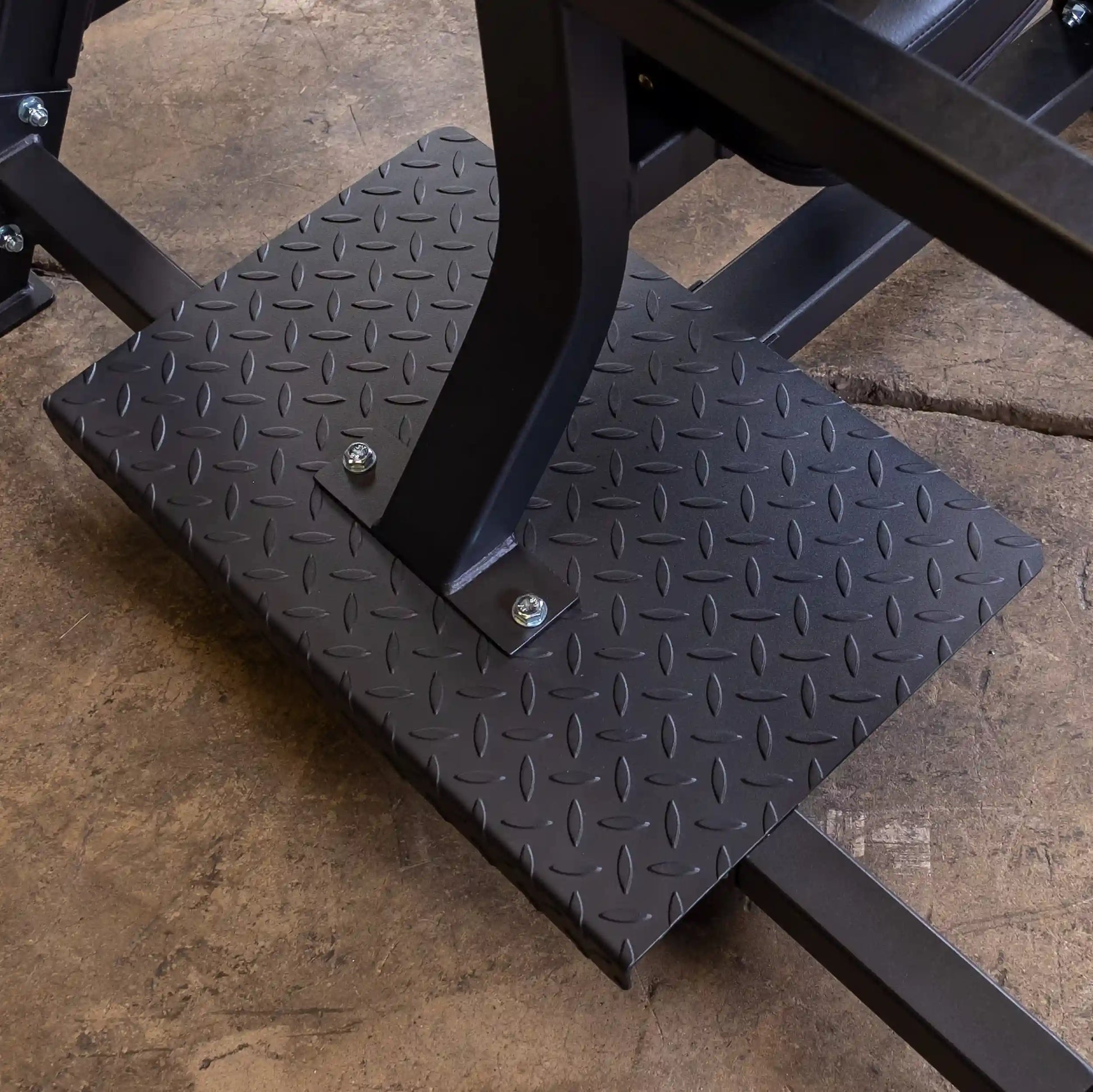 Close-up view of the textured base of the Body-Solid Pro Clubline Shoulder Olympic Bench SOSB250, showcasing its sturdy construction and support features.