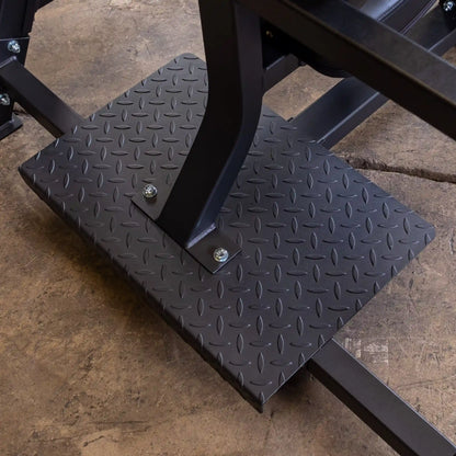 Close-up view of the textured base of the Body-Solid Pro Clubline Shoulder Olympic Bench SOSB250, showcasing its sturdy construction and support features.