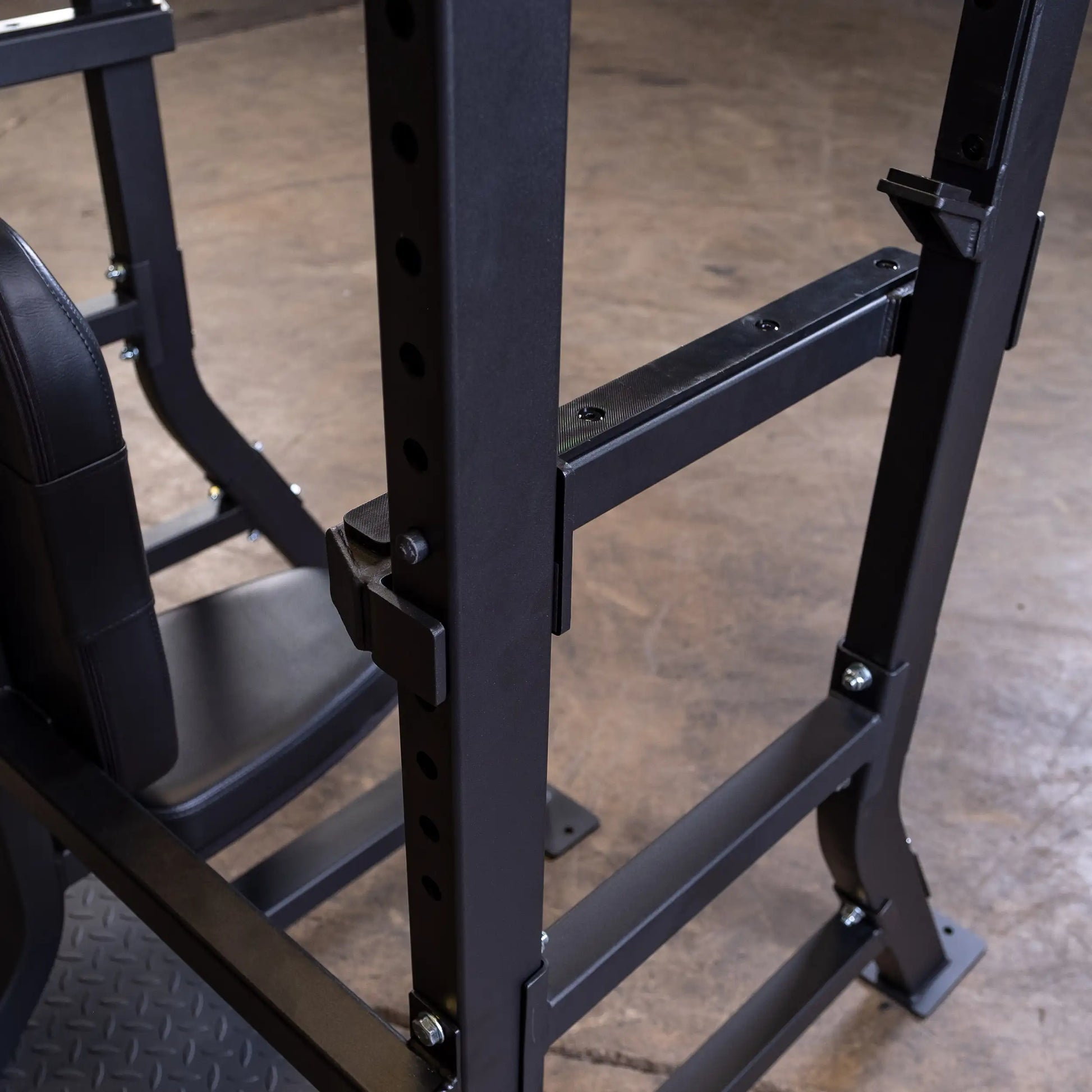 Close-up view of the Body-Solid Pro Clubline Shoulder Olympic Bench SOSB250, showcasing the sturdy metal frame and adjustable features.