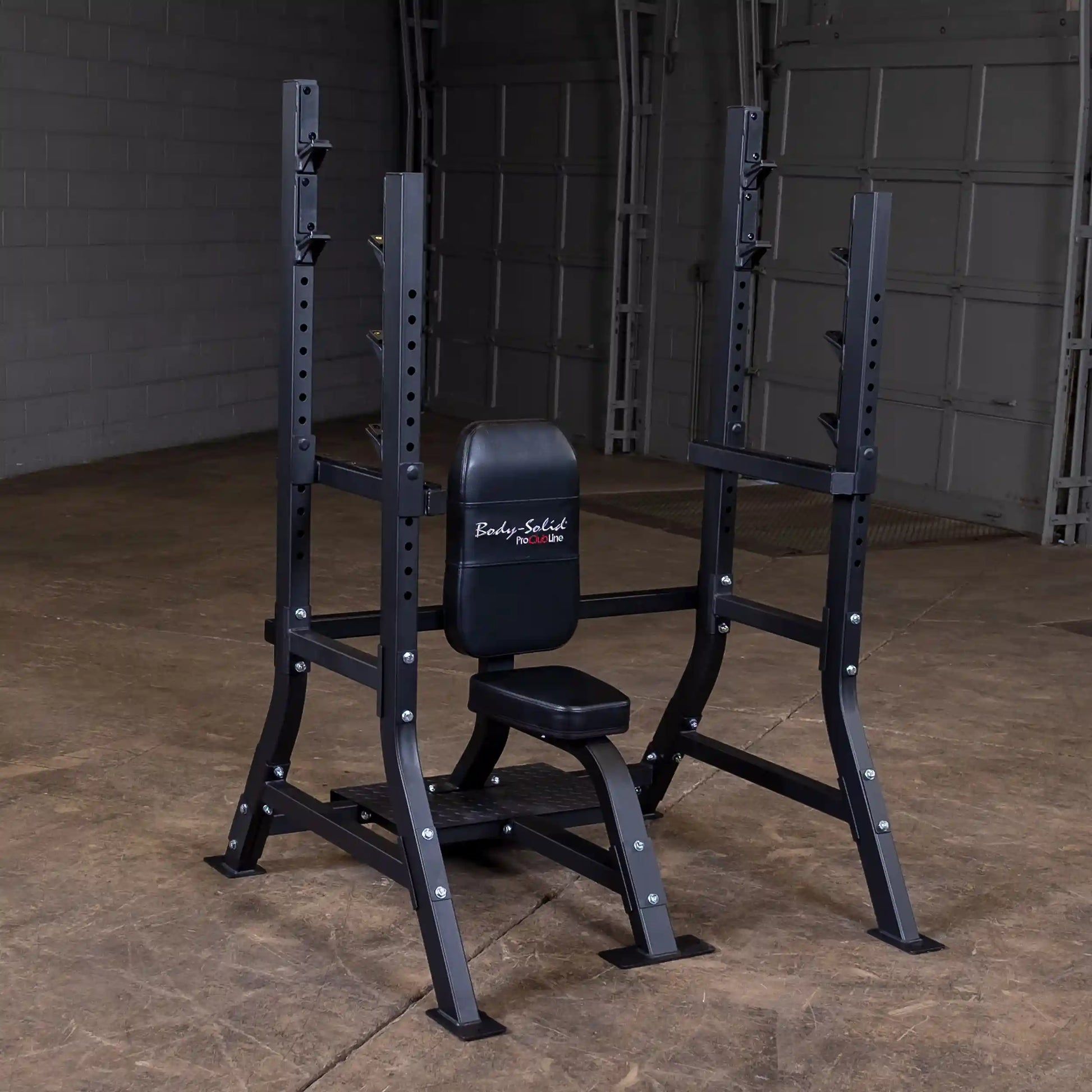 Body-Solid Pro Clubline Shoulder Olympic Bench SOSB250, featuring a sturdy black frame with a padded seat and backrest, set against a plain background in a gym environment.