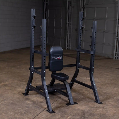 Body-Solid Pro Clubline Shoulder Olympic Bench SOSB250, featuring a sturdy black frame with a padded seat and backrest, set against a plain background in a gym environment.
