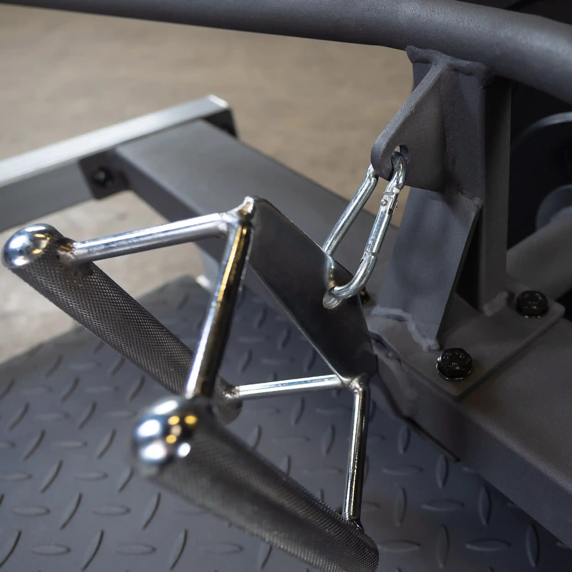 Close-up view of the Body-Solid Pro Clubline T-Bar Row Machine STBR500, showcasing the handle attachment and metal hook.