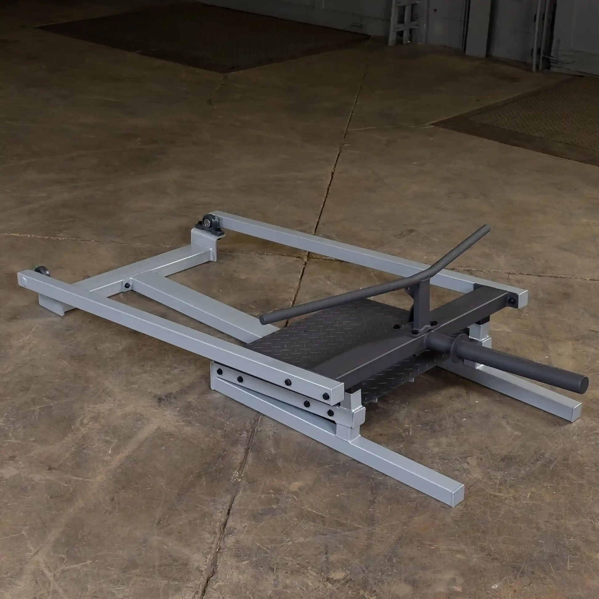 Body-Solid Pro Clubline T-Bar Row Machine STBR500 positioned on a concrete floor, showcasing its sturdy frame and design.