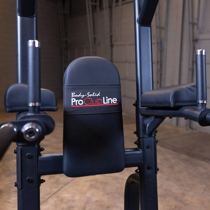 Close-up of the Body-Solid Pro Clubline Vertical Knee Raise SVKR1000, featuring a padded backrest and arm supports, set against a neutral background.