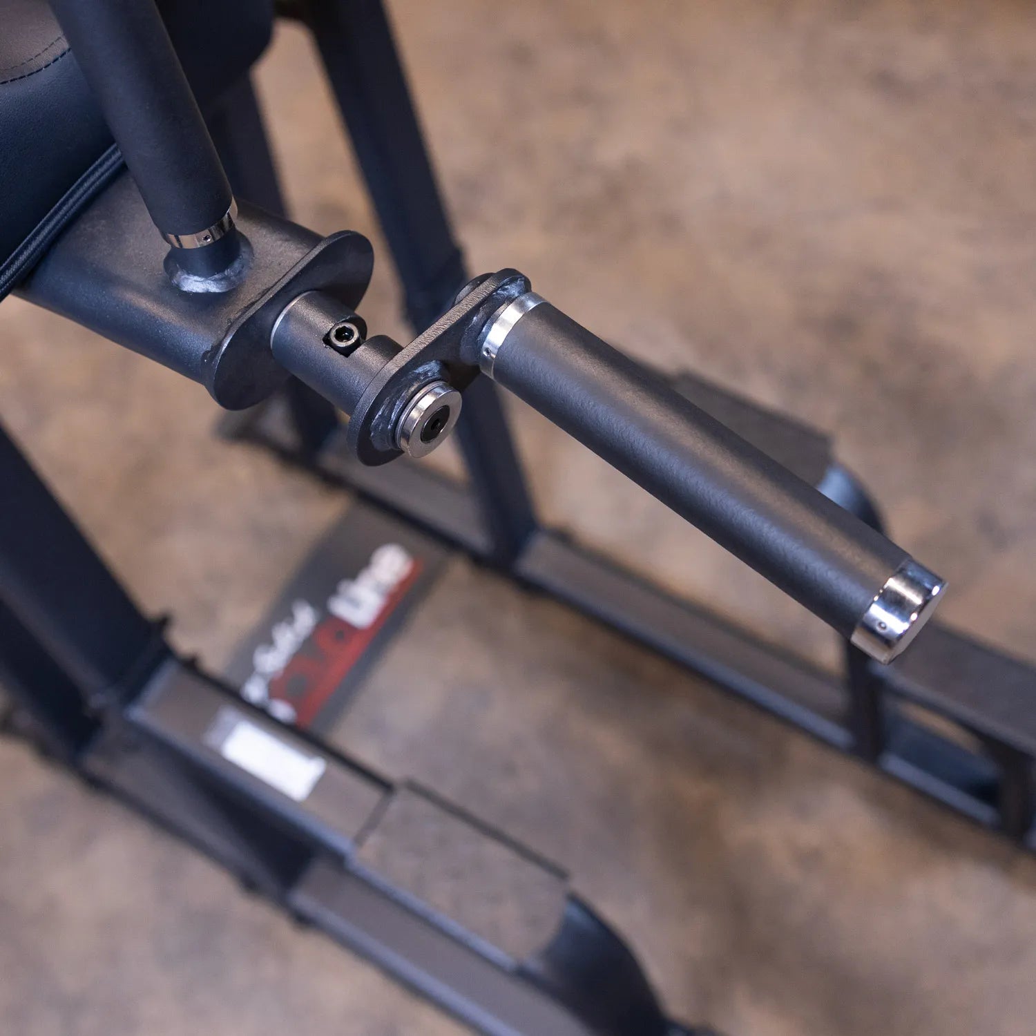 Close-up view of the Body-Solid Pro Clubline Vertical Knee Raise SVKR1000, showcasing the armrest and handle design.