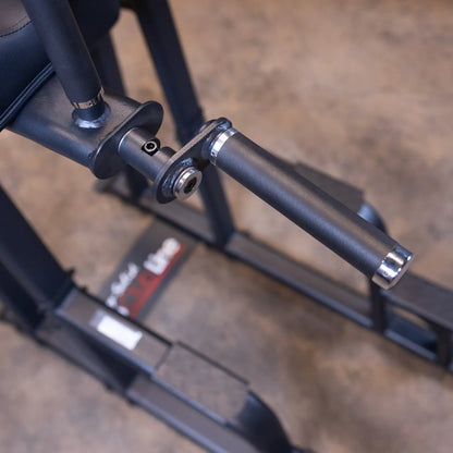 Close-up view of the Body-Solid Pro Clubline Vertical Knee Raise SVKR1000, showcasing the armrest and handle design.