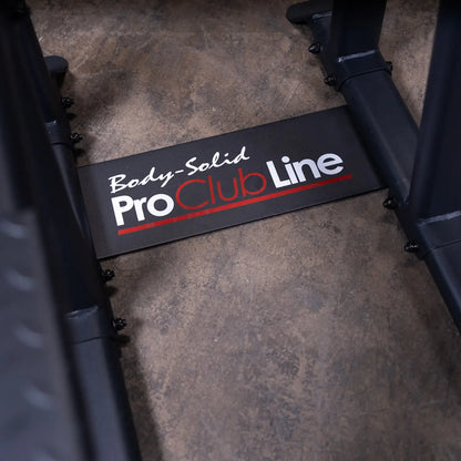 Image showing the logo of the Body-Solid Pro Clubline Vertical Knee Raise SVKR1000, prominently displayed on a black plate at the base of the equipment.