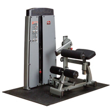 Image of the Body-Solid Pro Dual Ab & Back Machine DABBSF, featuring a grey and black design with padded rollers and an adjustable seat, set on a rubber mat.