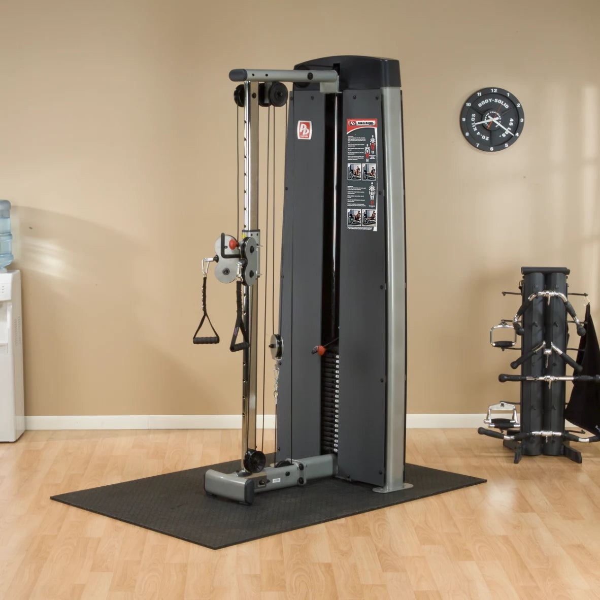 Image of the Body-Solid Pro Dual Cable Column Machine DPCCSF, showcasing its dual cable system, adjustable pulleys, and ergonomic design in a gym setting.