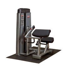 Body-Solid Pro Dual Bicep & Tricep Machine DBTCSF, featuring adjustable seating and dual exercise stations for bicep and tricep workouts, set on a rubber mat.