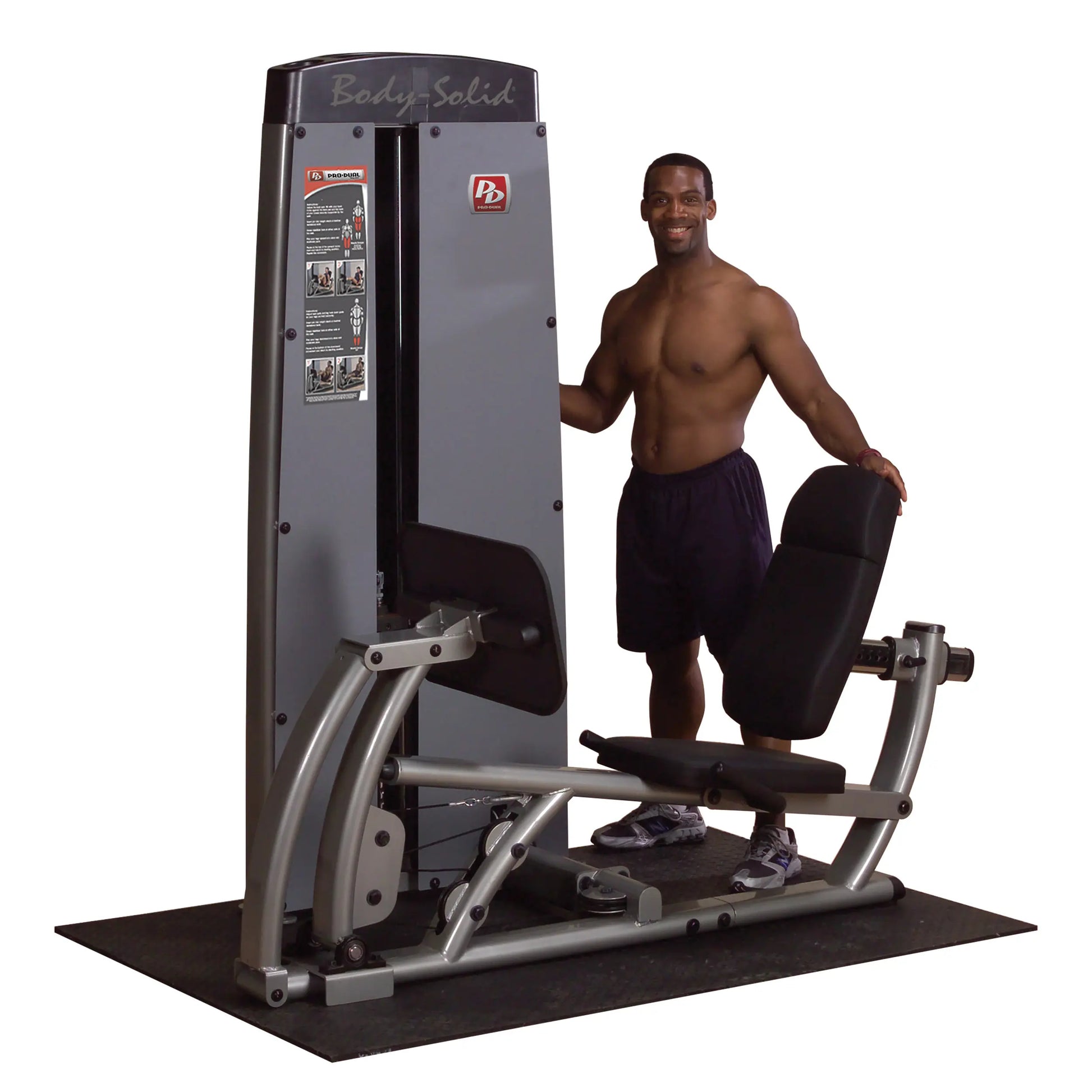 Body-Solid Pro Dual Leg & Calf Press Machine DCLPSF with a man standing beside it, showcasing the equipment designed for leg and calf exercises.