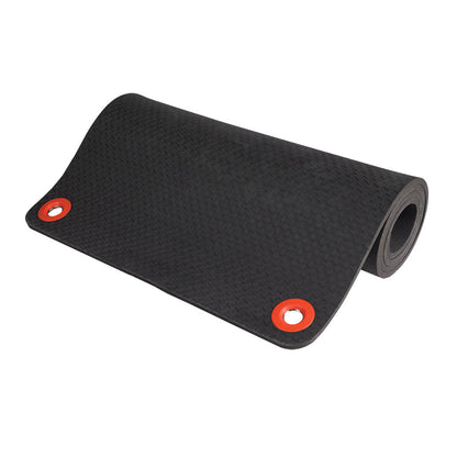 Black foam exercise mat with textured surface and red grommet eyelets at corners for hanging storage.