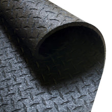 Rolled black rubber gym flooring mat with diamond pattern texture.