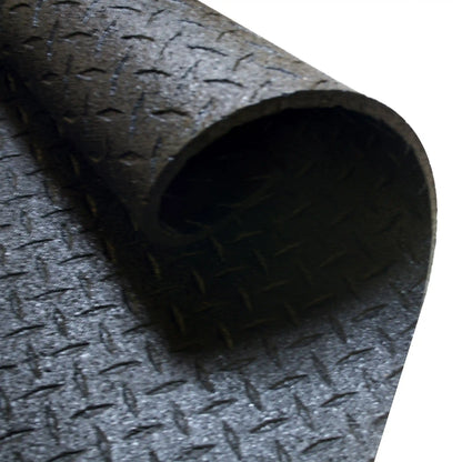 Rolled black rubber gym flooring mat with diamond pattern texture.