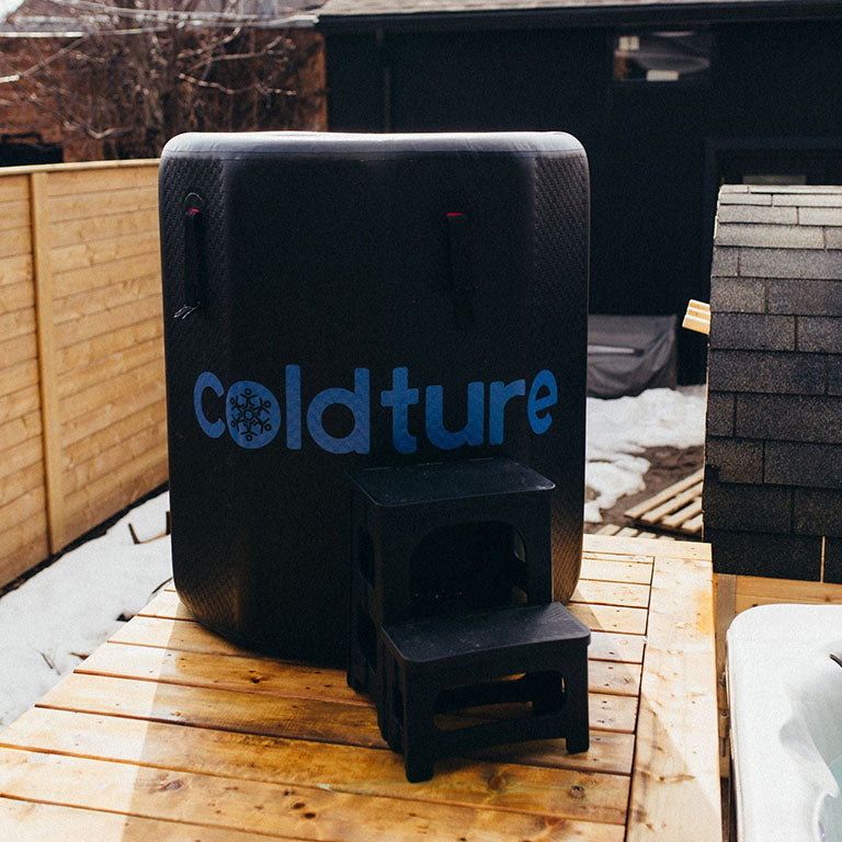 Coldture Barrel + Chiller Pro on a wooden platform in a snowy outdoor setting.