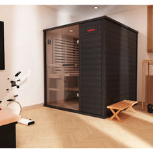 Modern indoor sauna by Coldture, featuring a sleek black design and transparent door for a stylish wellness experience.