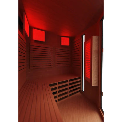 Infrared sauna with warm red lighting and wooden benches for relaxation.