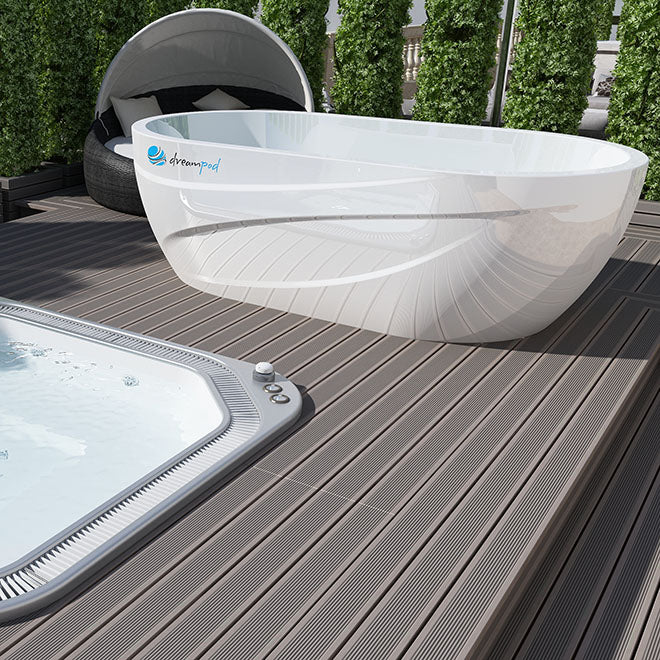 Dreampod Commercial Cold Plunge displayed on a wooden deck, with a sleek, modern design and a nearby hot tub.