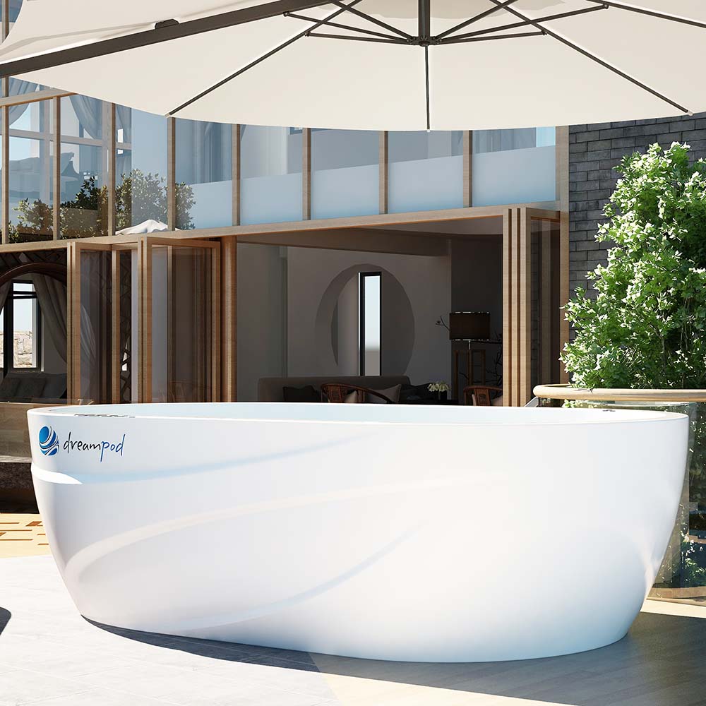 Dreampod Commercial Cold Plunge displayed outdoors under a large umbrella, with a modern architectural backdrop featuring glass and wooden elements.