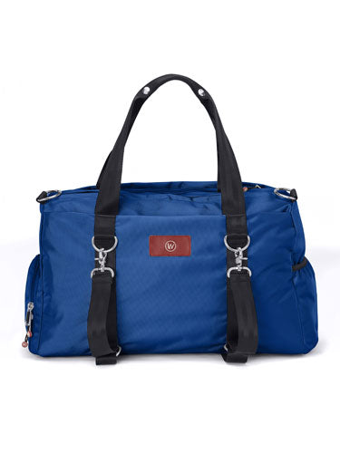 Blue duffel bag with black straps and silver hardware.