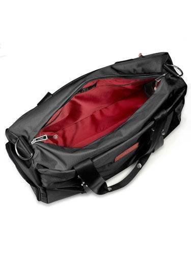 Open black duffel bag with red interior lining.