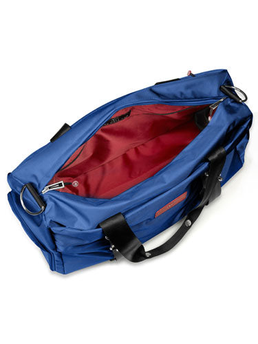 Blue duffel bag with red interior, open top and black handles.