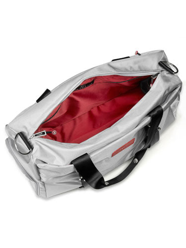 Open gray duffel bag showing bright red interior.