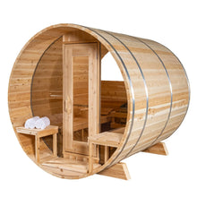 Wooden barrel sauna with door, benches, and towels.