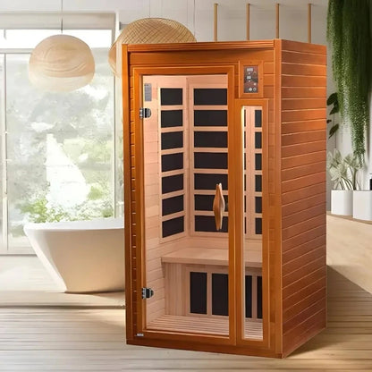 Dynamic Barcelona 1-2 Person Far Infrared Sauna in a modern interior setting, featuring a wooden sauna with a glass door and bench inside.