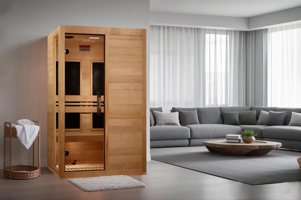 Two-person wooden infrared sauna in a modern living room.
