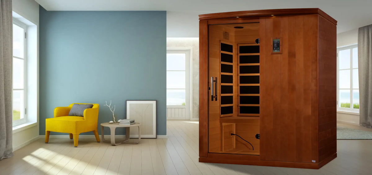Wooden three-person infrared sauna in a bright, modern living room.