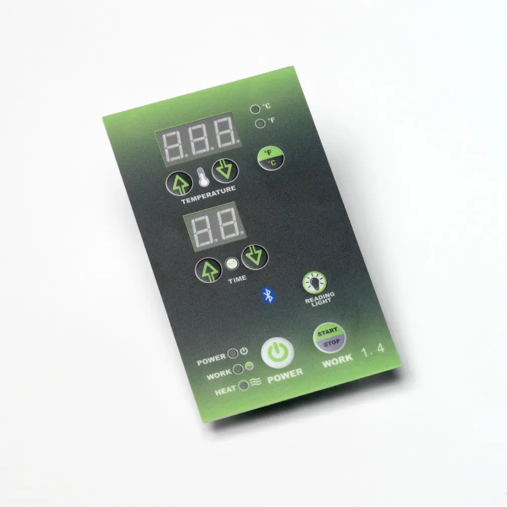 Infrared sauna control panel with digital displays and green buttons.