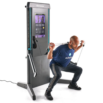 A person performing a squat exercise using the Echelon ES-PRO Commercial Strength Machine, featuring a digital display and adjustable cables.