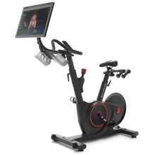 Echelon EX-5s Smart Connect Bike featuring a large screen for interactive workouts, adjustable seat, and handlebars with grips.