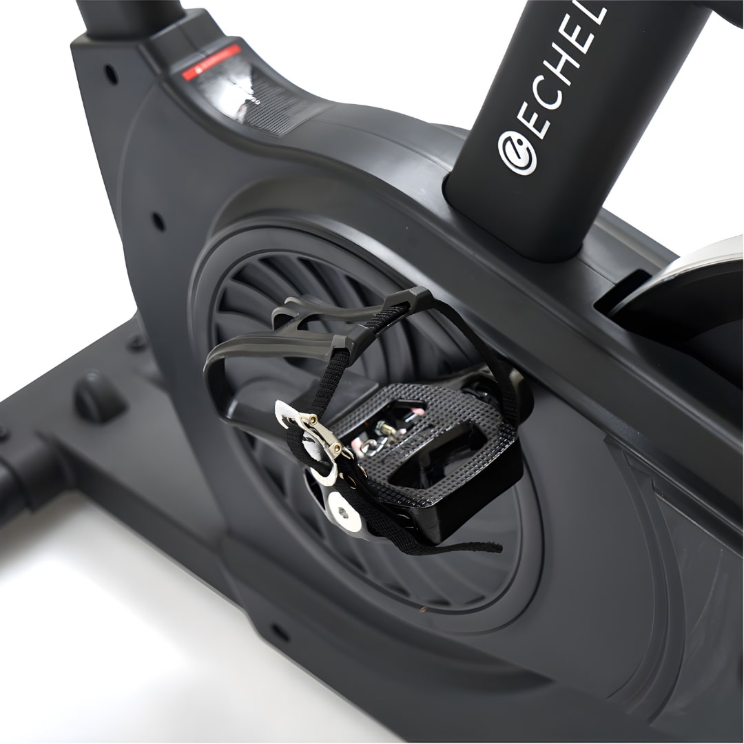 Close-up view of the Echelon EX-7s Smart Connect Bike, highlighting the pedal and flywheel design.