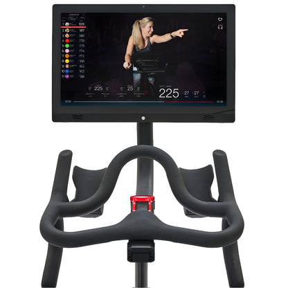 Echelon EX-PRO Smart Connect Bike featuring a large screen displaying a fitness instructor and performance metrics.