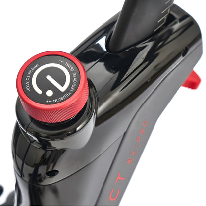 Close-up view of the tension adjustment knob on the Echelon EX-PRO Smart Connect Bike, featuring a red design and instructions for use.