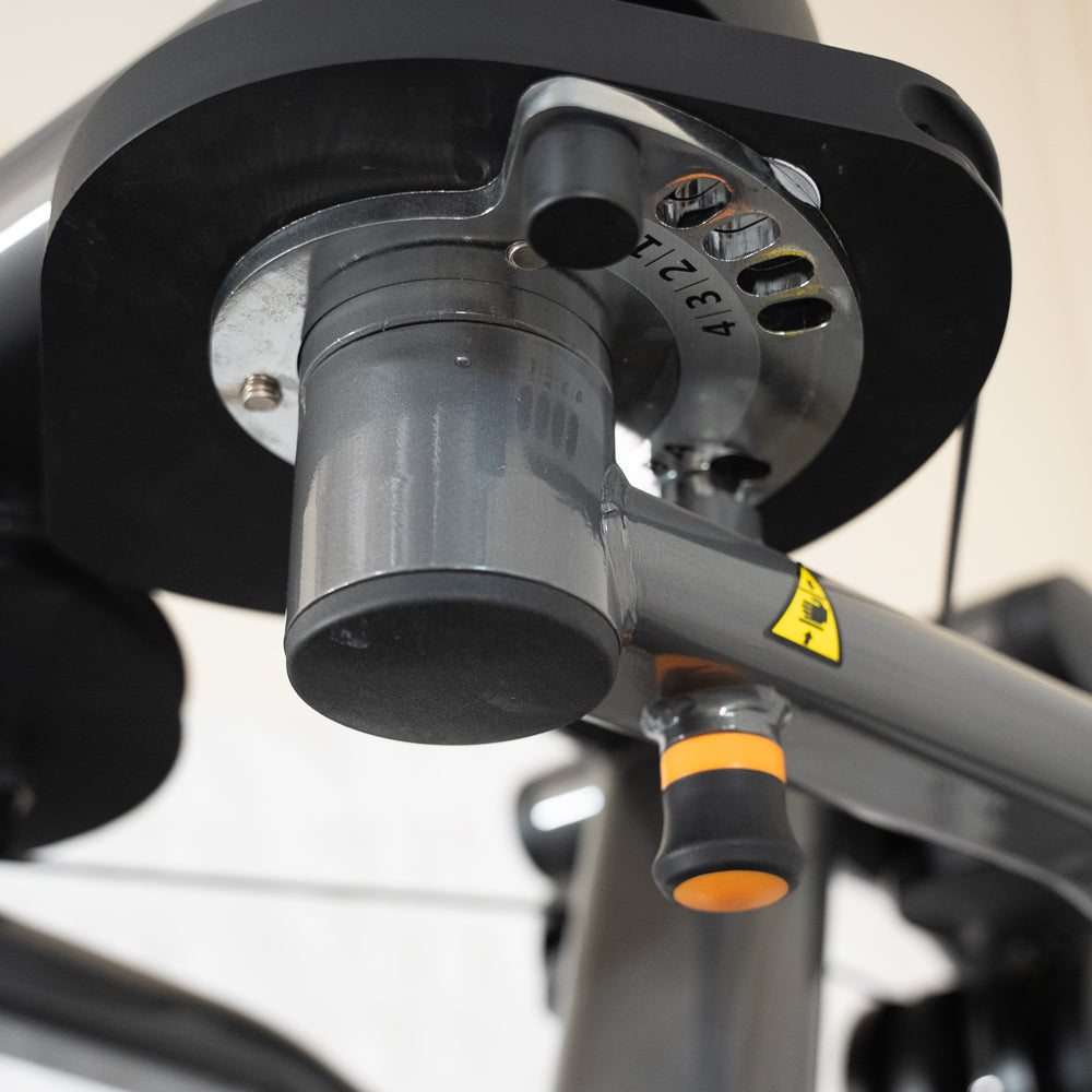 Close-up of Elite Plus Pec-Rear Delt machine joint and handle.