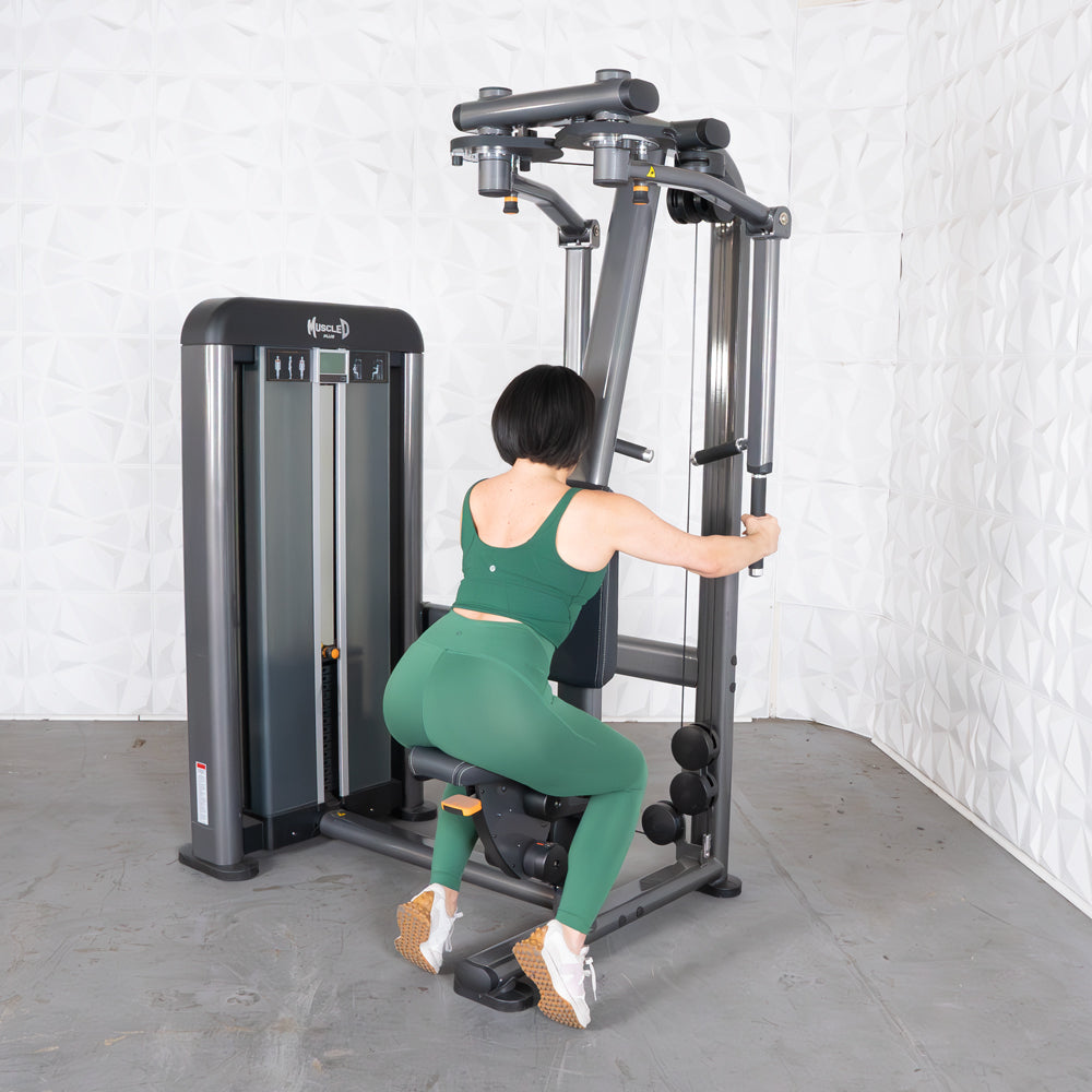 Person using Elite Plus Pec/Rear Delt gym machine.