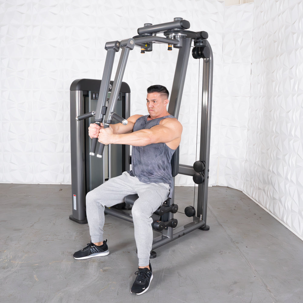 Man using Elite Plus Pec-Rear Delt machine for chest and shoulder workout.