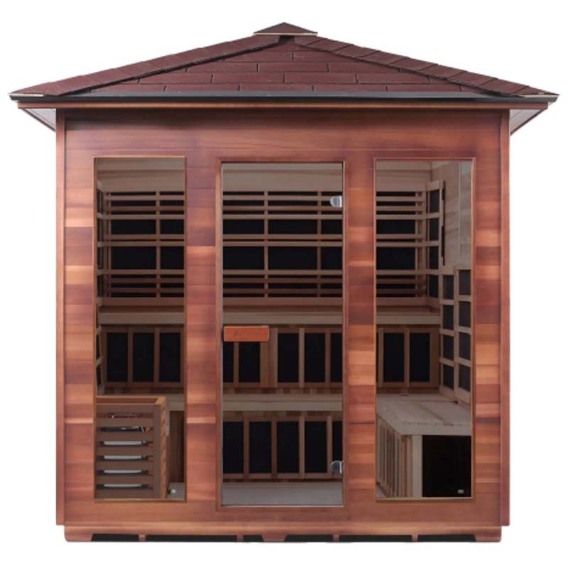 Four-person infrared sauna in rich cedar wood finish with clear glass doors.