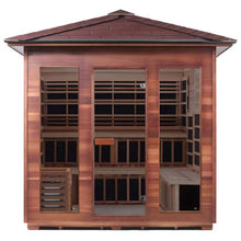 Four-person infrared sauna in rich cedar wood finish with clear glass doors.