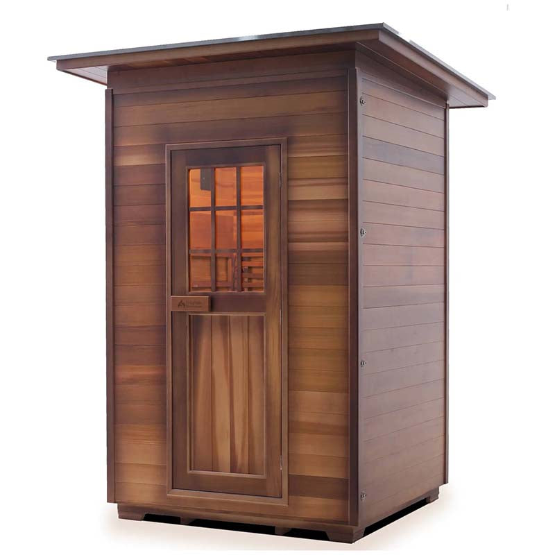 Outdoor sauna by Allwood with cedar wood finish and slanted roof.