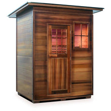 Outdoor cedar infrared sauna with glass-panel door and window.