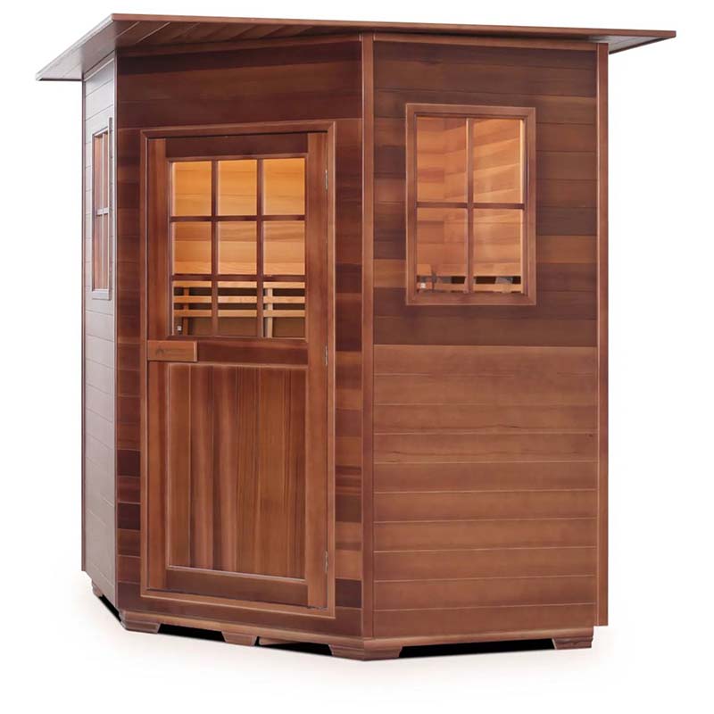 Outdoor cedar sauna with glass door and window, featuring a slanted roof for efficient rain runoff.