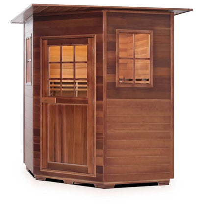Outdoor cedar sauna with glass door and window, featuring a slanted roof for efficient rain runoff.