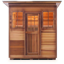Wooden outdoor sauna with glass-paneled door and two windows, featuring warm interior lighting.