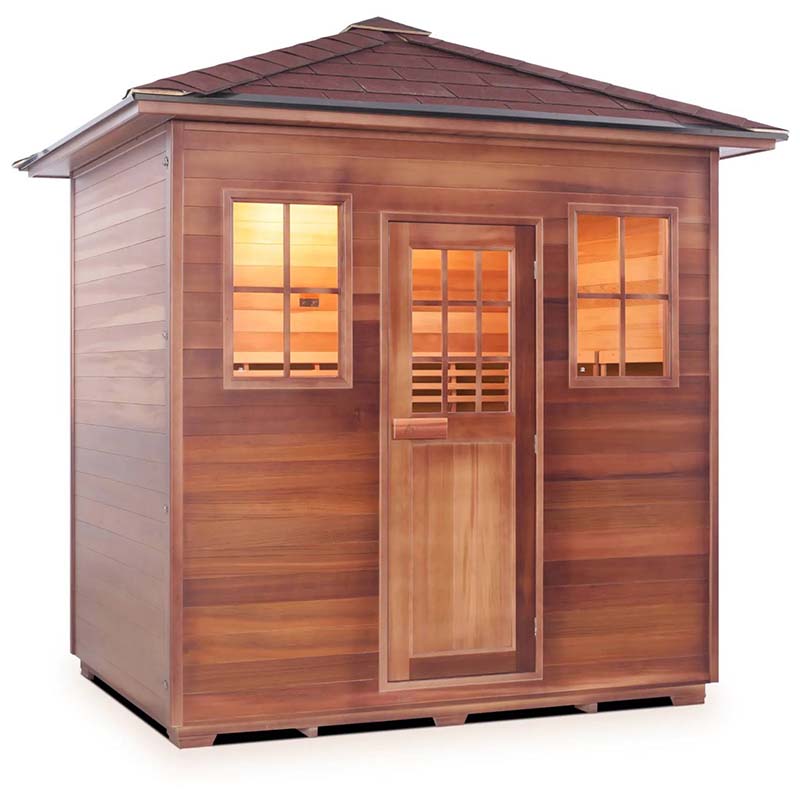 Outdoor cedar sauna with large windows and shingled roof, ideal for home relaxation.