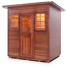 Outdoor cedar sauna with glass windows and wooden door, perfect for a relaxing spa experience.