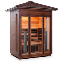 Outdoor infrared sauna with glass doors and wooden finish.